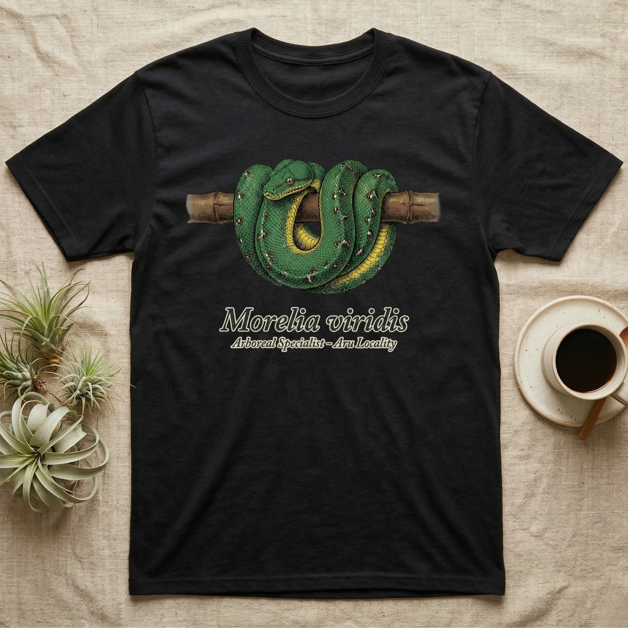 Black t-shirt with green tree python design and text "Morelia viridis".