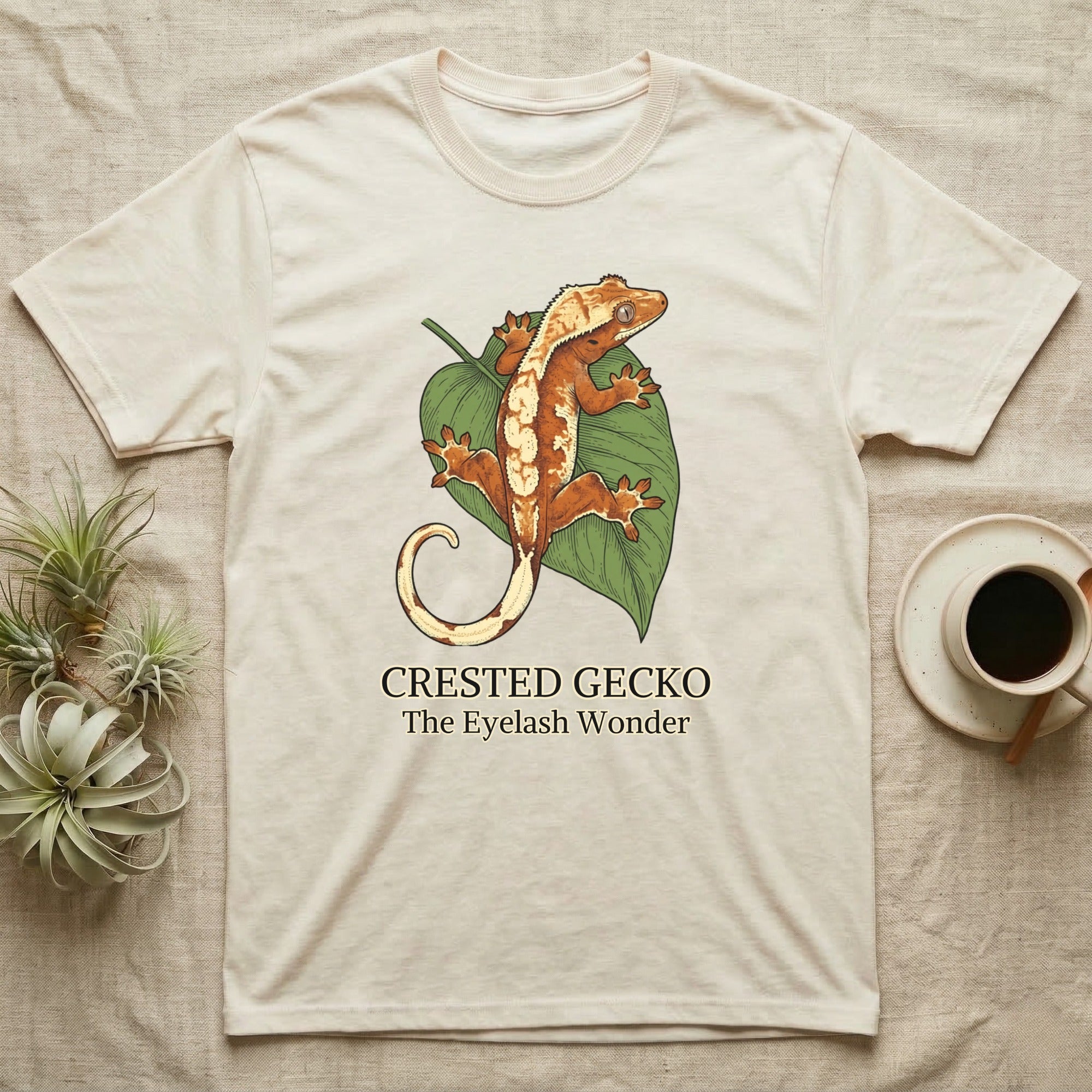 Crested gecko illustration on a cream t-shirt with text.