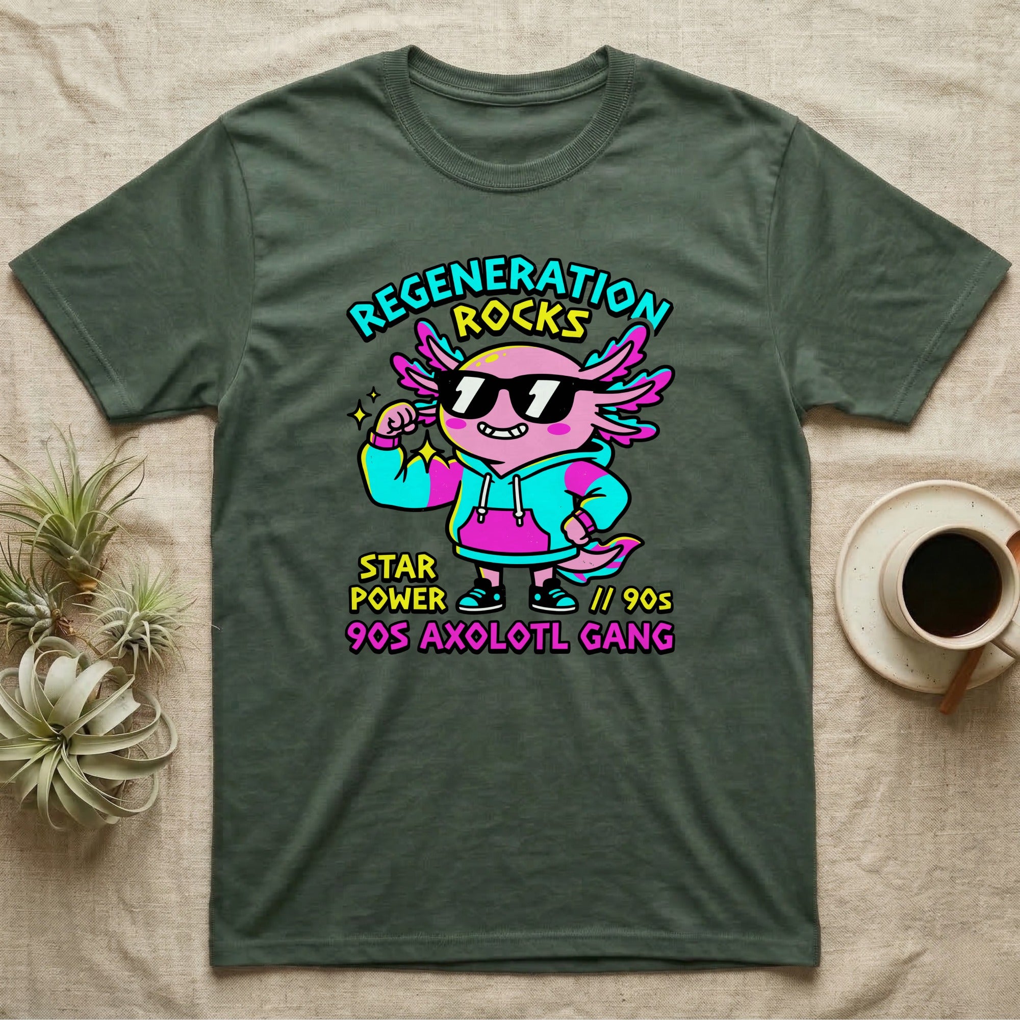 Axolotl Regeneration Rocks T-Shirt in Military Green — Neon 90s cartoon pink axolotl in shades flexing under "Regeneration Rocks" lettering.