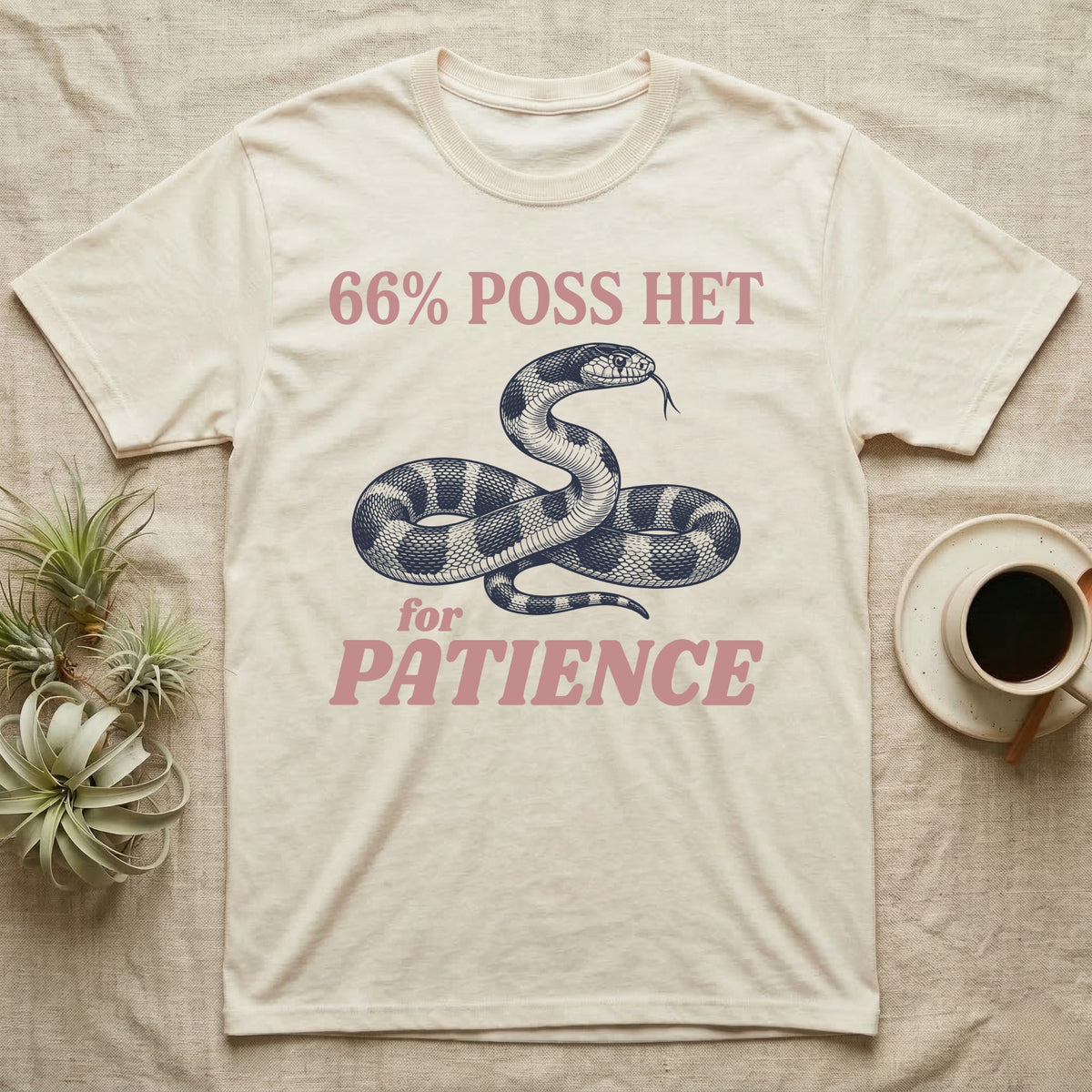 Kingsnake Patience T-Shirt in Natural — Navy engraving of a banded California kingsnake head raised and tongue flicking, between 66% POSS HET and for PATIENCE in rose type