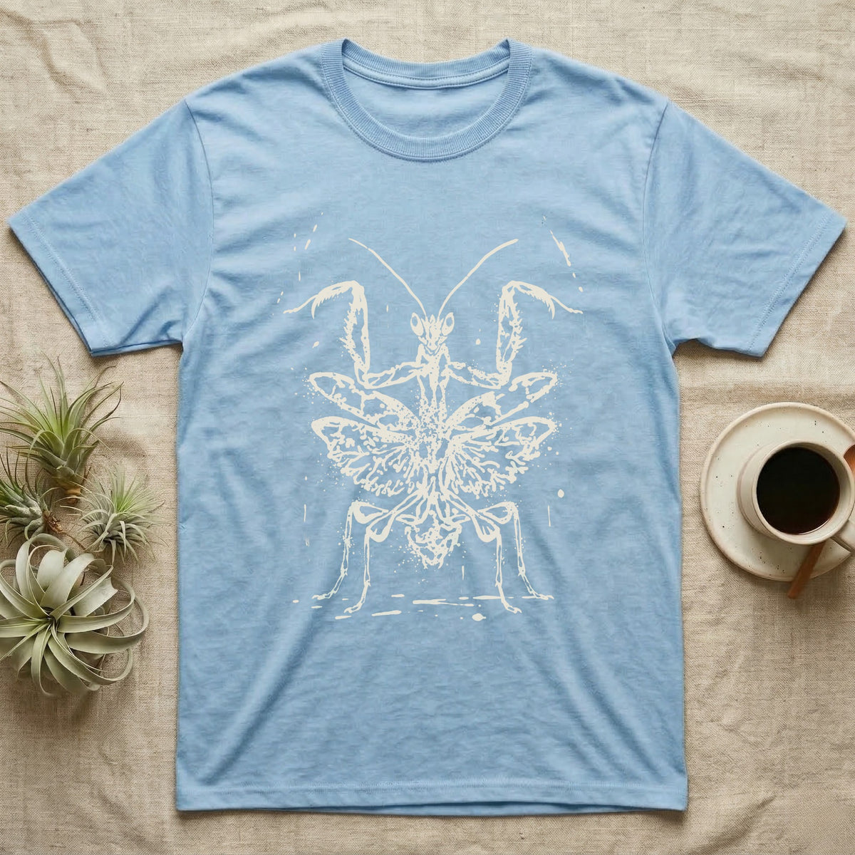 Orchid Mantis Threat Display T-Shirt in Light Blue — Bleach-spatter stencil illustration of an orchid mantis reared square-on into a full threat display.