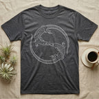Ackie Monitor Roundel T-Shirt in Dark Heather — Two ackie monitors in fine white line art, mirrored at 180 degrees around a tiny heart, tails sweeping outward.