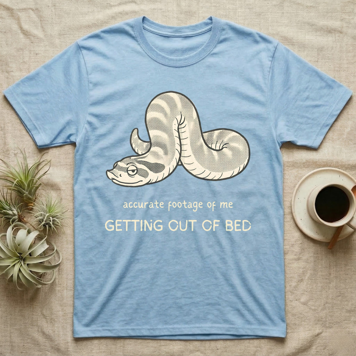Hognose Morning Mood T-Shirt in Light Blue — Retro-illustration of a hognose snake flopped limp with hand-drawn marker text about getting out of bed.