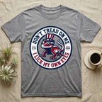 Crested Gecko 1776 T-Shirt in Sport Grey — Distressed crest of a crested gecko in a top hat with text Don't Tread On Me and I Lick My Own Eyes.