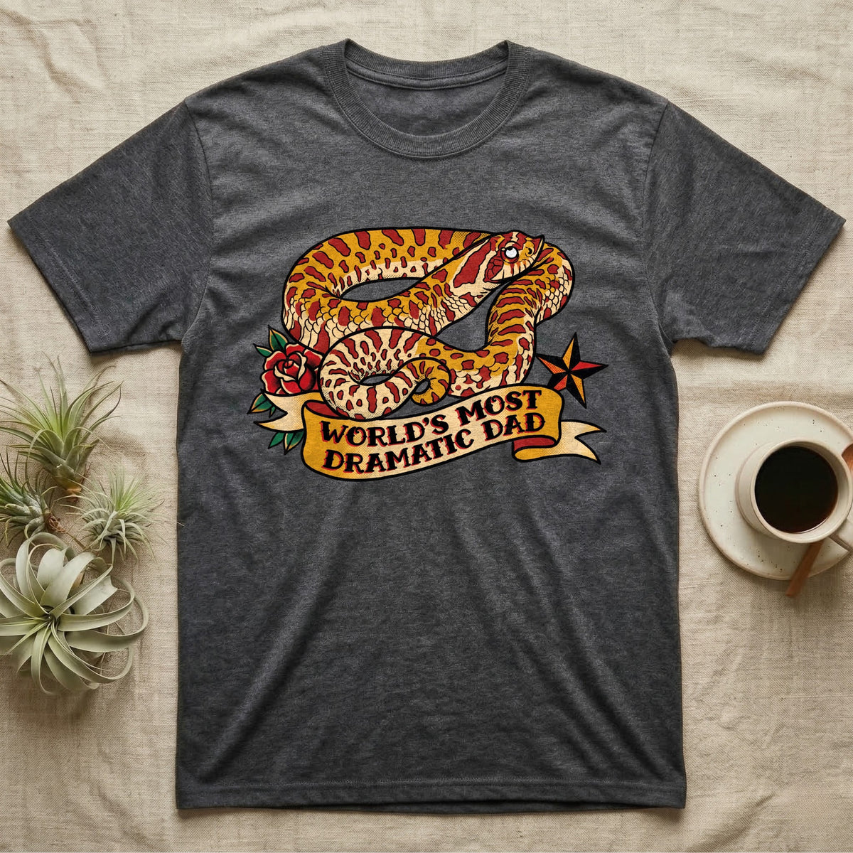Dramatic Dad Hognose T-Shirt in Dark Heather — Tattoo-flash illustration of a hognose snake mid-dramatic-flop with a banner reading World's Most Dramatic Dad.