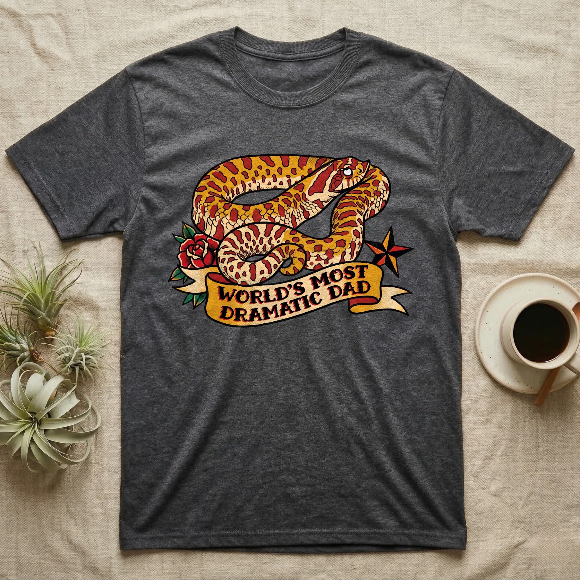 Dramatic Dad Hognose T-Shirt in Dark Heather — Tattoo-flash illustration of a hognose snake mid-dramatic-flop with a banner reading World's Most Dramatic Dad.
