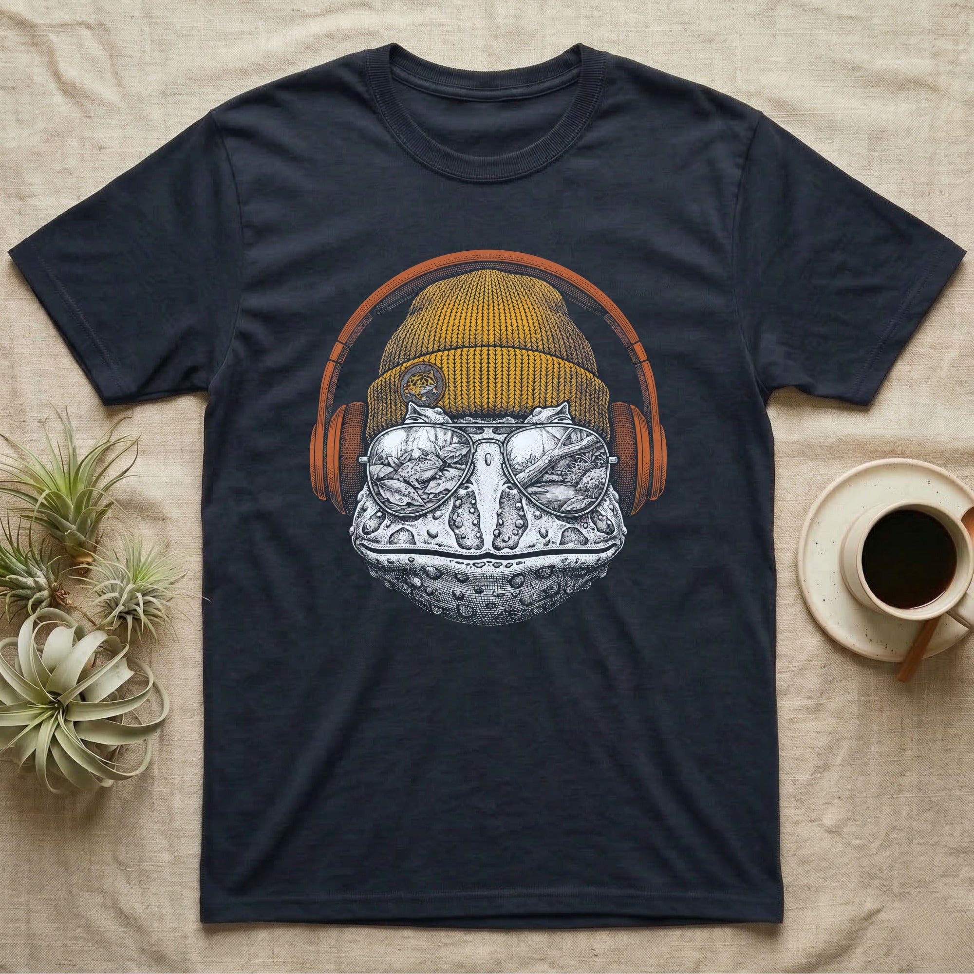 Pacman Frog Chill Beats T-Shirt in Navy — Engraved Pacman horned frog with wide bumpy skin in a beanie and headphones, aviators reflecting a woodland pond.