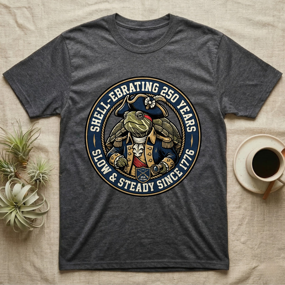 Sea Turtle General T-Shirt in Dark Heather — Circular crest of a sea turtle dressed as a Continental general with text Shell-Ebrating 250 Years.