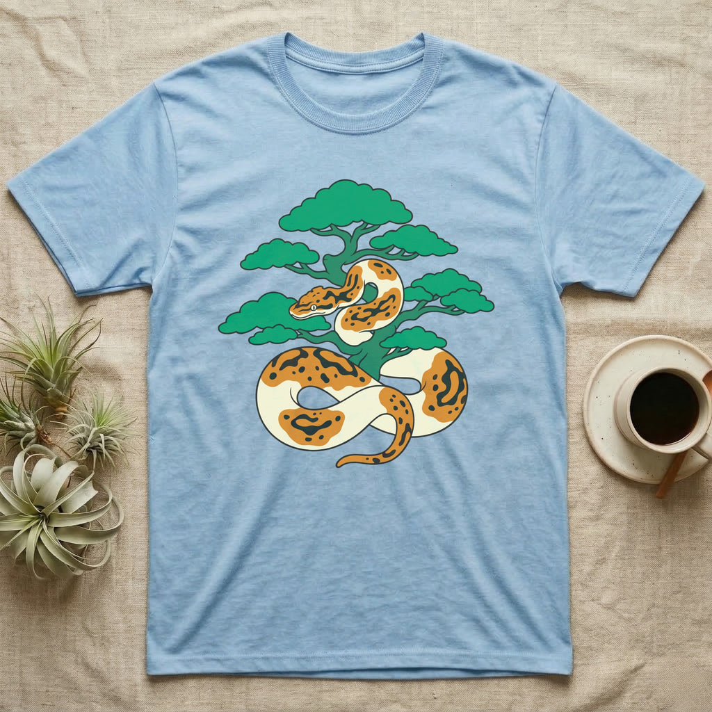 Light blue t-shirt with a coiled orange and white snake around a green tree.