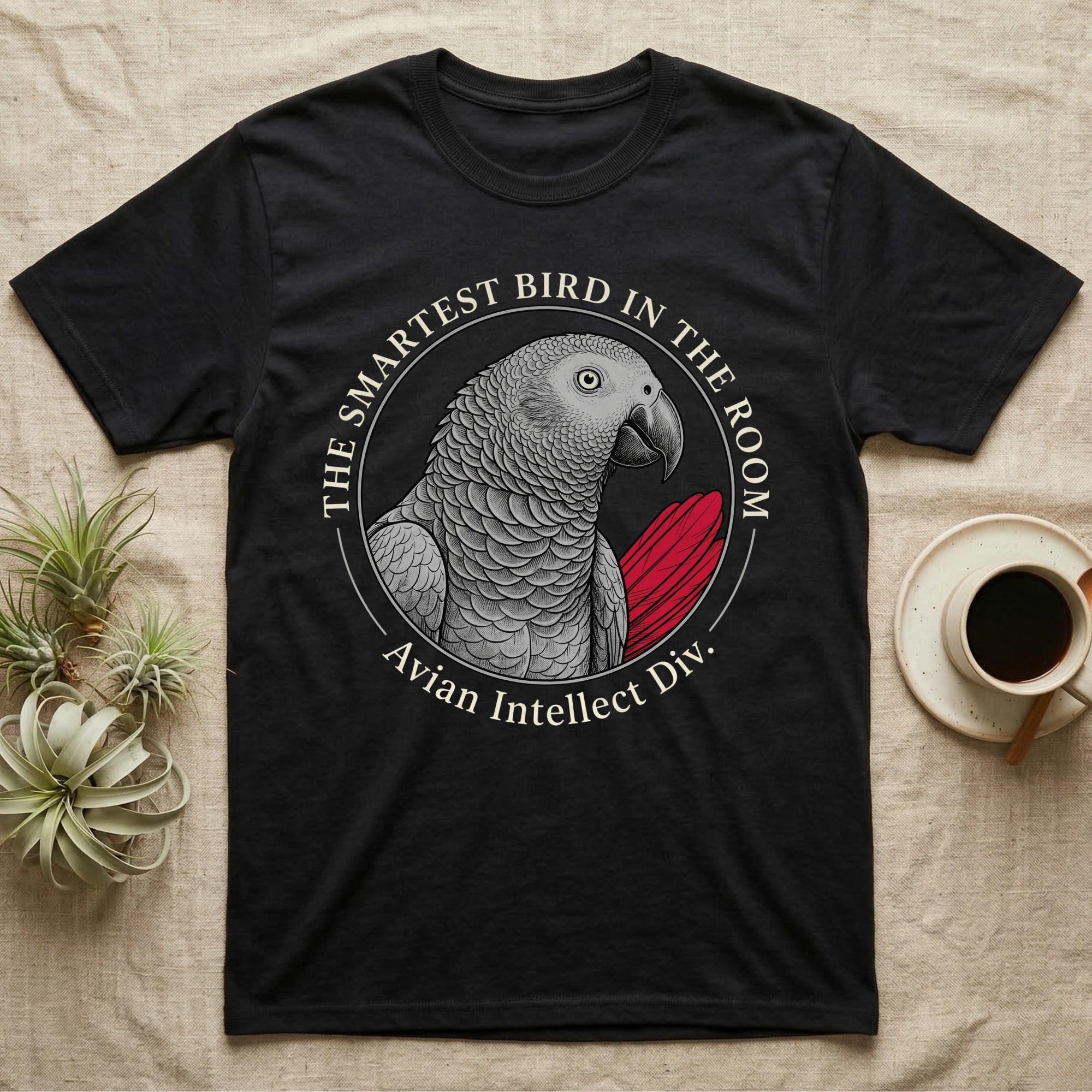 Black t-shirt with graphic of a gray parrot and text "The Smartest Bird in the Room. Avian Intellect Div."