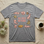 Axolotl All Gills No Plans T-Shirt in Sport Grey — Cartoon sticker collection of six leucistic axolotls resting among a mug, socks, a blanket and a book, under the words ALL GILLS NO PLANS.