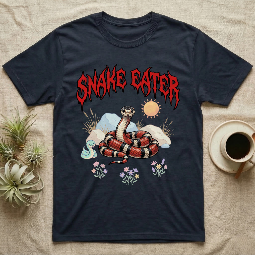 California Kingsnake Feral T-Shirt in Navy — Banded California kingsnake coiled with a tiny companion snake under a jagged blood-red metal wordmark and pastel scene.