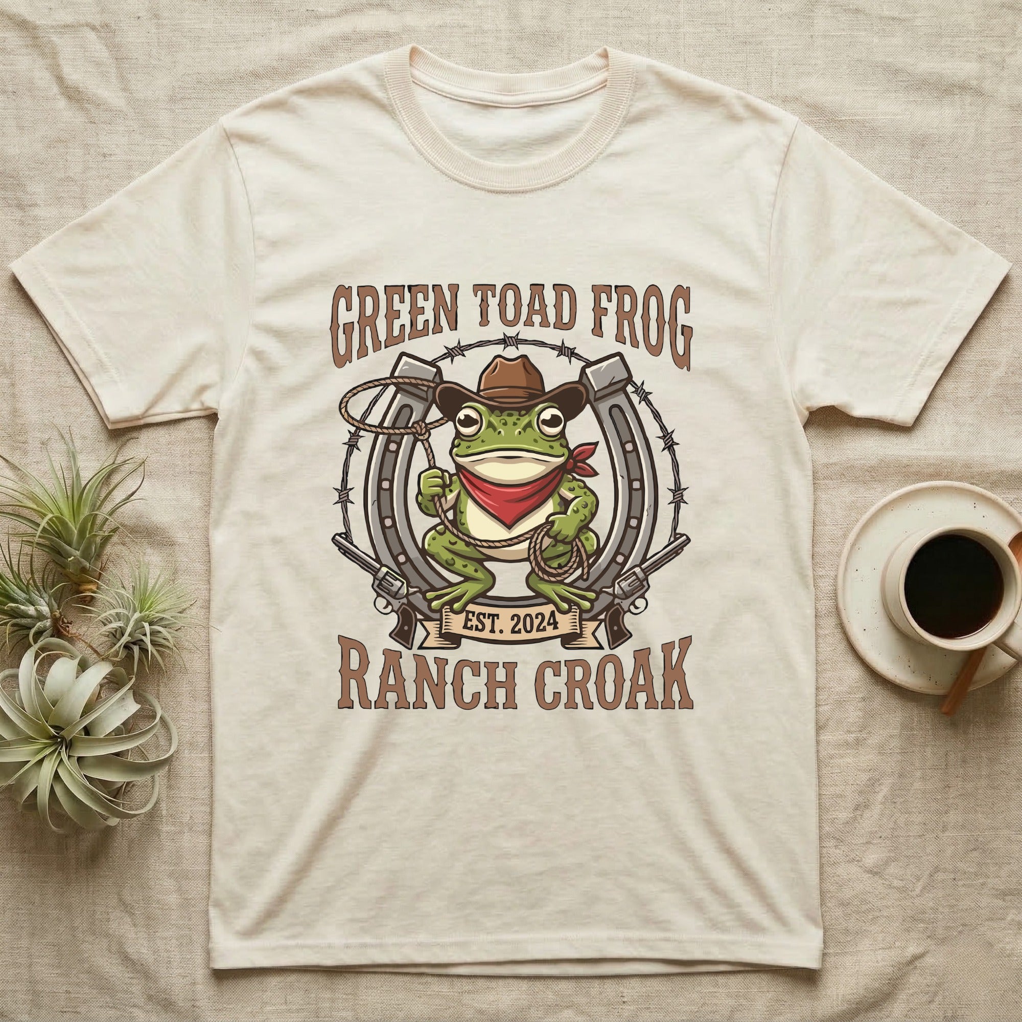 Green Toad Frog Ranch Croak t-shirt with cowboy frog, horseshoe, and guns.