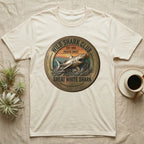 Cream t-shirt with "Wild Shark Club Great White Shark Pacific Coast Est. 1993" circular logo.