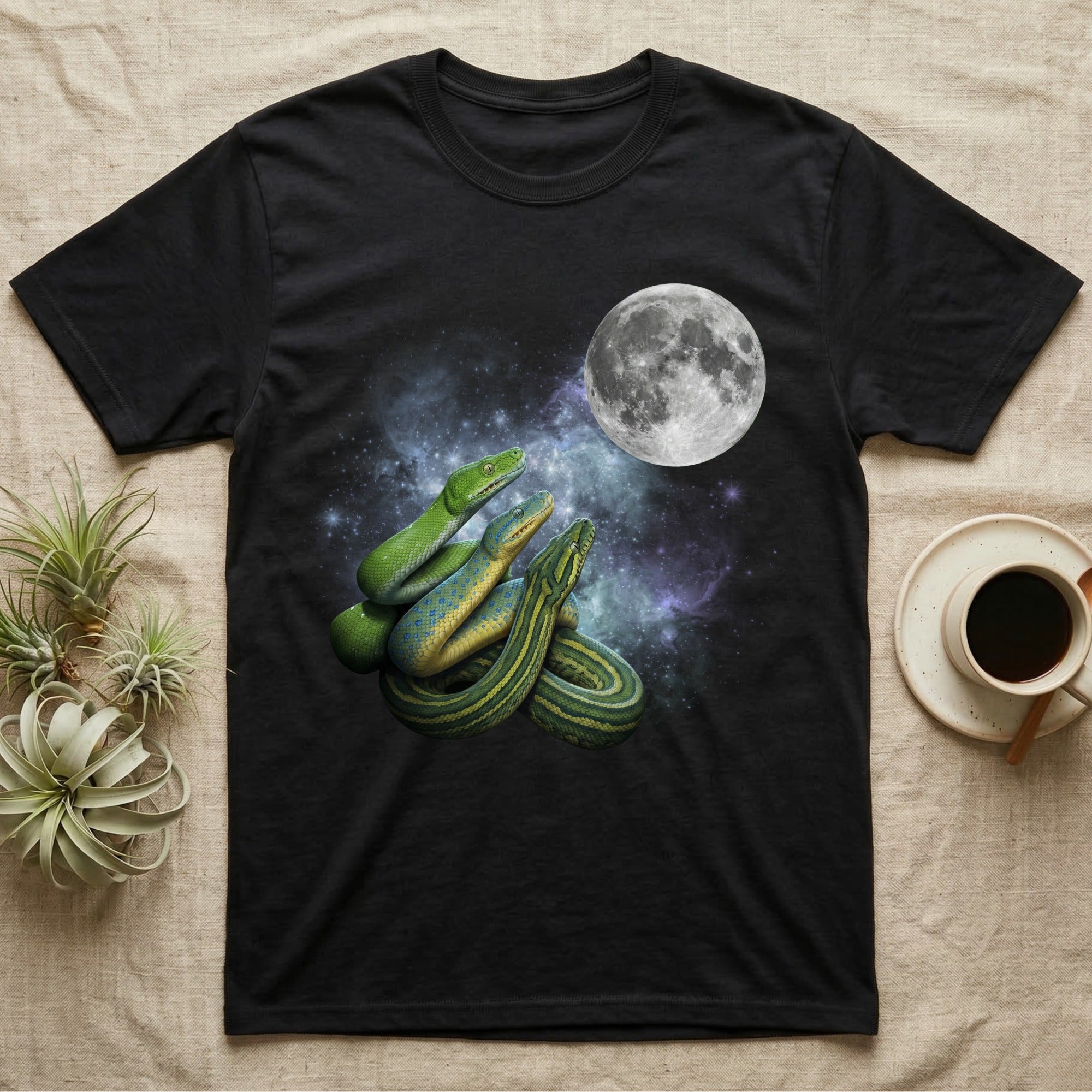 Green Tree Python Moon Howl T-Shirt in Black — Three Green Tree Python colour morphs howling at a full moon over a nebula on a dark grey t-shirt.