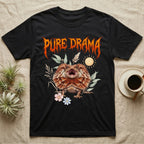Frilled Dragon Feral T-Shirt in Black — Frilled dragon with its neck frill flared and mouth gaping under a jagged fiery-orange metal "PURE DRAMA" wordmark.