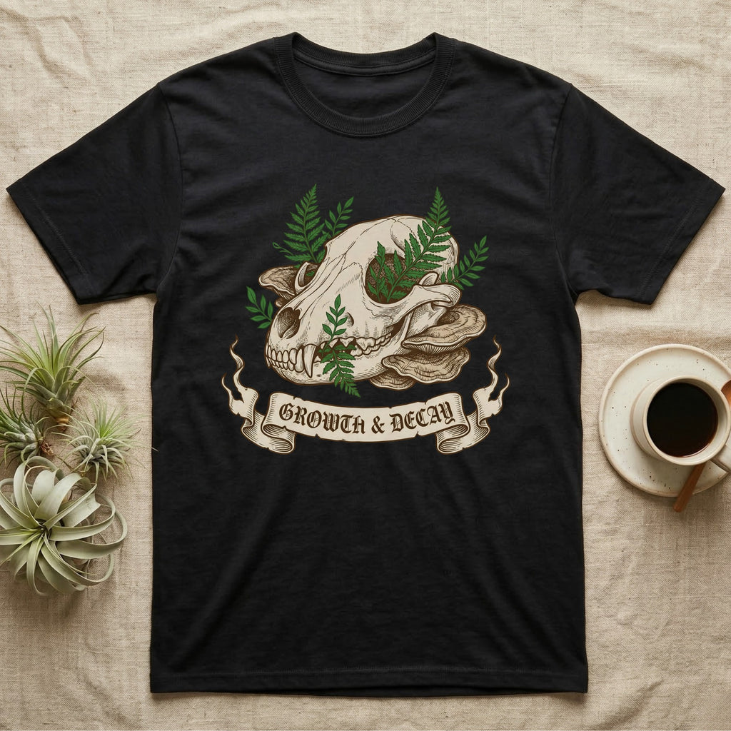Black t-shirt featuring skull, mushrooms, ferns, and "Growth & Decay" banner.