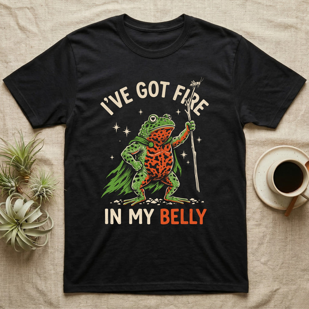Fire-Bellied Toad Knight T-Shirt in Black — Fire-bellied toad knight with green cape, orange belly and a cricket on a twig spear, lettered I'VE GOT FIRE IN MY BELLY