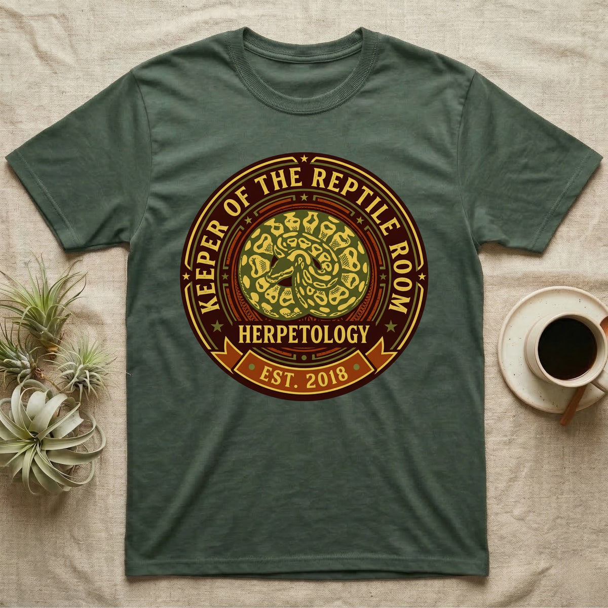 Green t-shirt with "Keeper of the Reptile Room" and "Est. 2018" text.