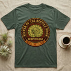 Green t-shirt with "Keeper of the Reptile Room" and "Est. 2018" text.