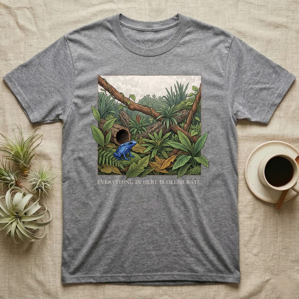 Dart Frog Bioactive Vivarium T-Shirt in Sport Grey — Illustrated panel of a cobalt dart frog in a layered planted vivarium, leaves crossing the inked border.