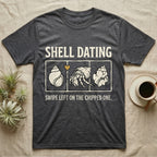 Hermit Crab Shell Dating T-Shirt in Dark Heather — Vintage-ink hermit crab leaning toward a pristine shell, chipped shell on the right, carved type "Shell Dating. Swipe Left."