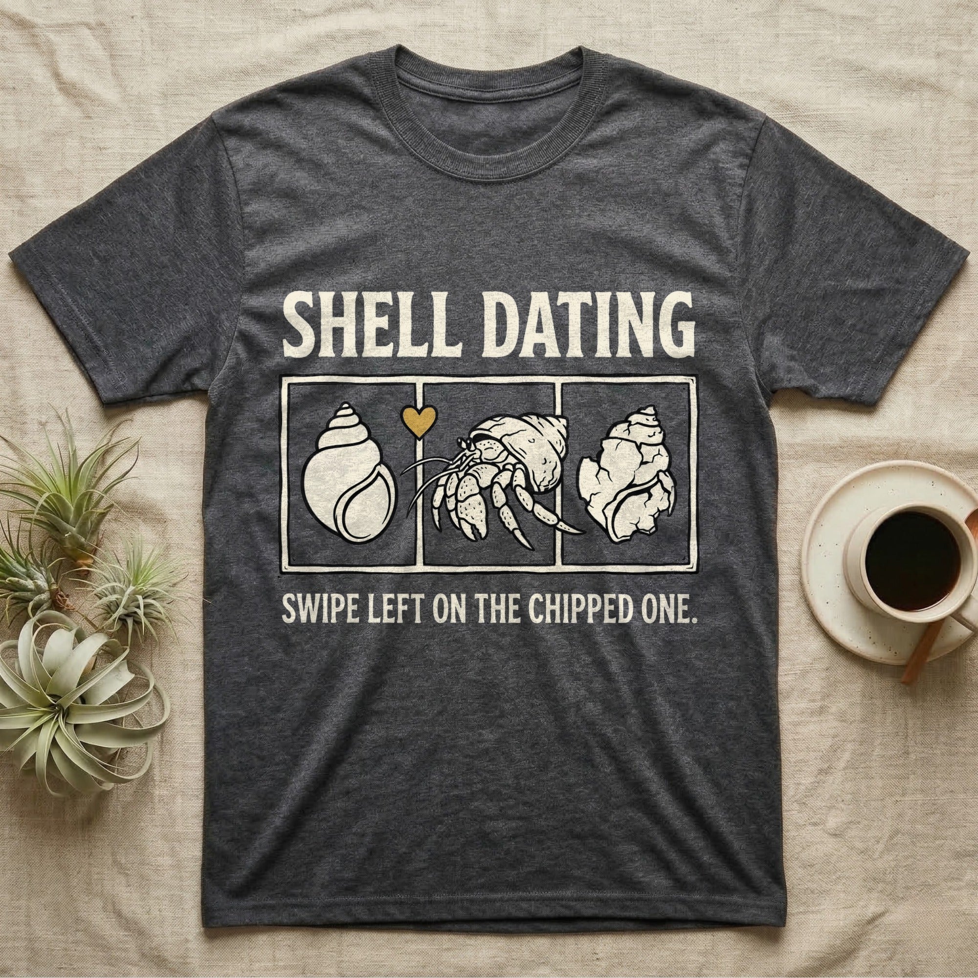 Hermit Crab Shell Dating T-Shirt in Dark Heather — Vintage-ink hermit crab leaning toward a pristine shell, chipped shell on the right, carved type "Shell Dating. Swipe Left."
