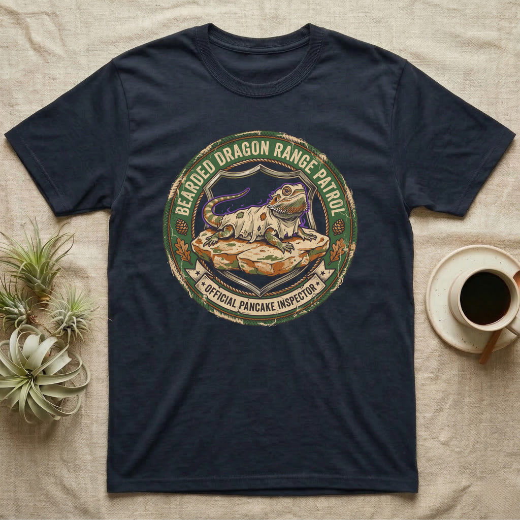 Bearded Dragon Pancake Inspector T-Shirt in Navy — Weathered ranger badge of a bearded dragon flattened on a rock, "Bearded Dragon Range Patrol, Official Pancake Inspector."