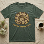 Green t-shirt with coiled snake graphic and text "SOCIAL BATTERY: 0%".