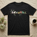 White's Tree Frog Canopy Crew T-Shirt in Black — Watercolor illustration of seven White's tree frogs in different colour phases on a eucalyptus branch, dark grey T-shirt design.