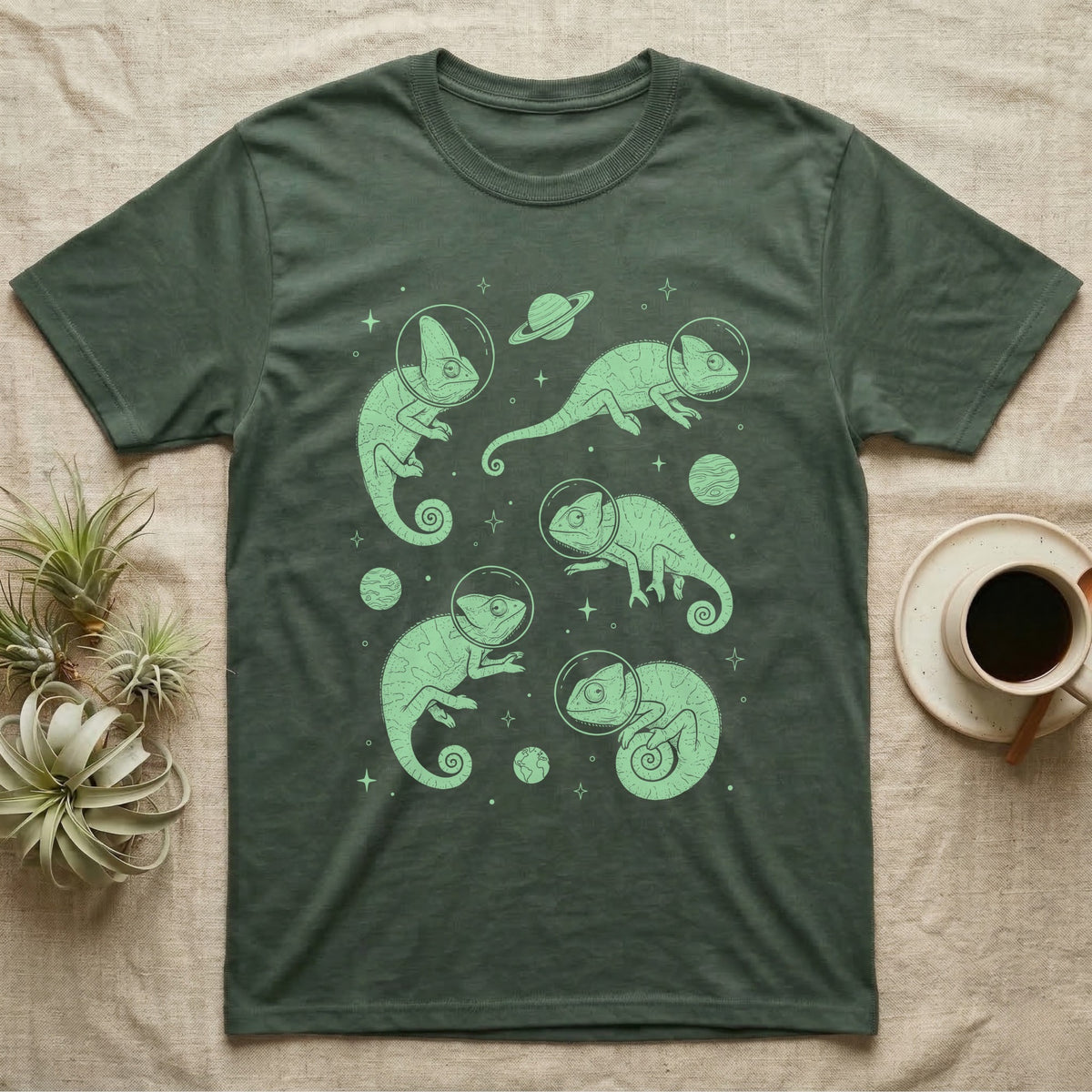Veiled Chameleon Cosmic T-Shirt in Military Green — Vintage screen-print illustration of veiled chameleons in astronaut helmets floating in space, cosmic nebula mint green monochromatic on dark background.