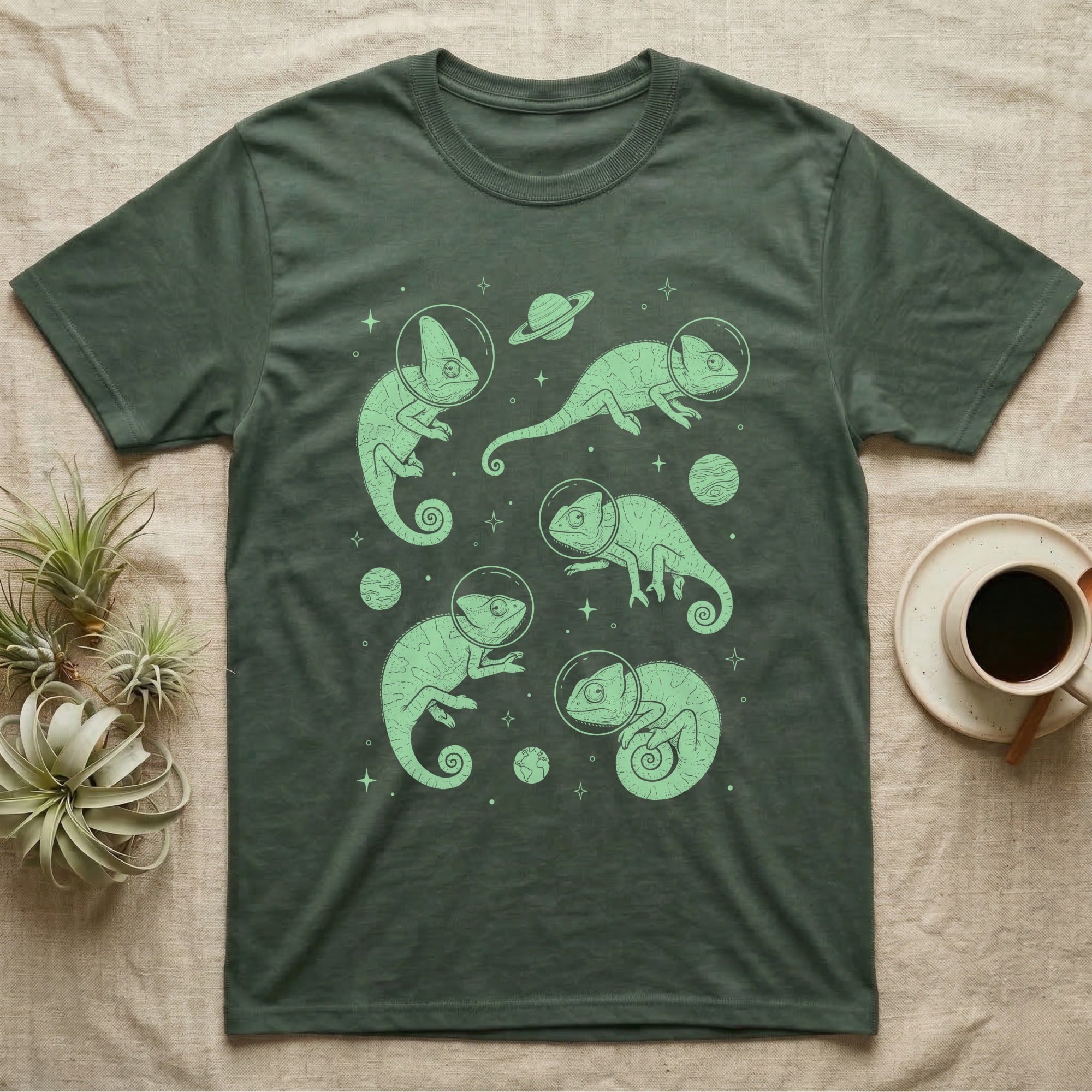 Veiled Chameleon Cosmic T-Shirt in Military Green — Vintage screen-print illustration of veiled chameleons in astronaut helmets floating in space, cosmic nebula mint green monochromatic on dark background.