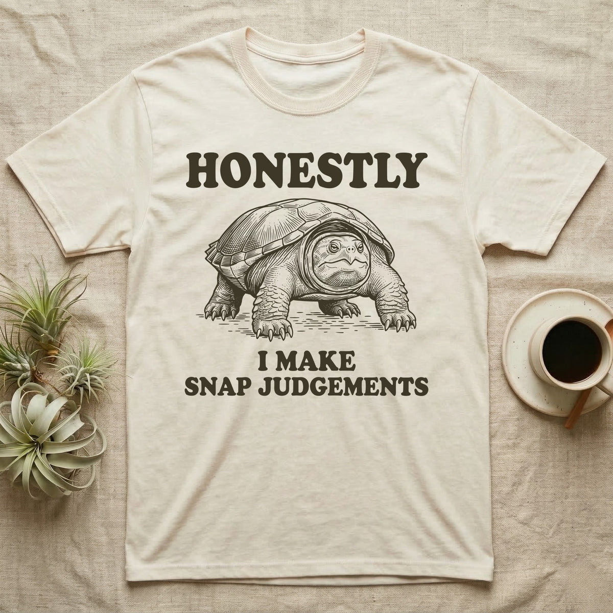 Snapping Turtle Judgements T-Shirt in Natural — Engraved snapping turtle standing, head forward, with the words Honestly, I Make Snap Judgements