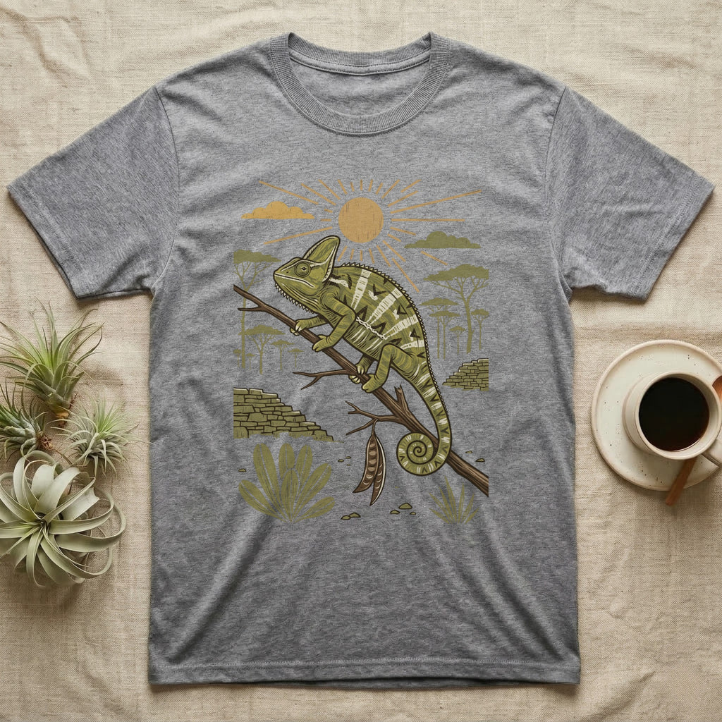 Veiled Chameleon Home Range T-Shirt in Sport Grey — Woodcut-style illustration of a veiled chameleon gripping an acacia branch with terraced walls and umbrella trees behind, no on-shirt text.