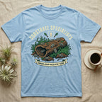 Zebra Isopod Substrate Specialists T-Shirt in Light Blue — Vintage crest of zebra isopods on a mossy cork log with crossed trowels and Armadillidium ribbon.