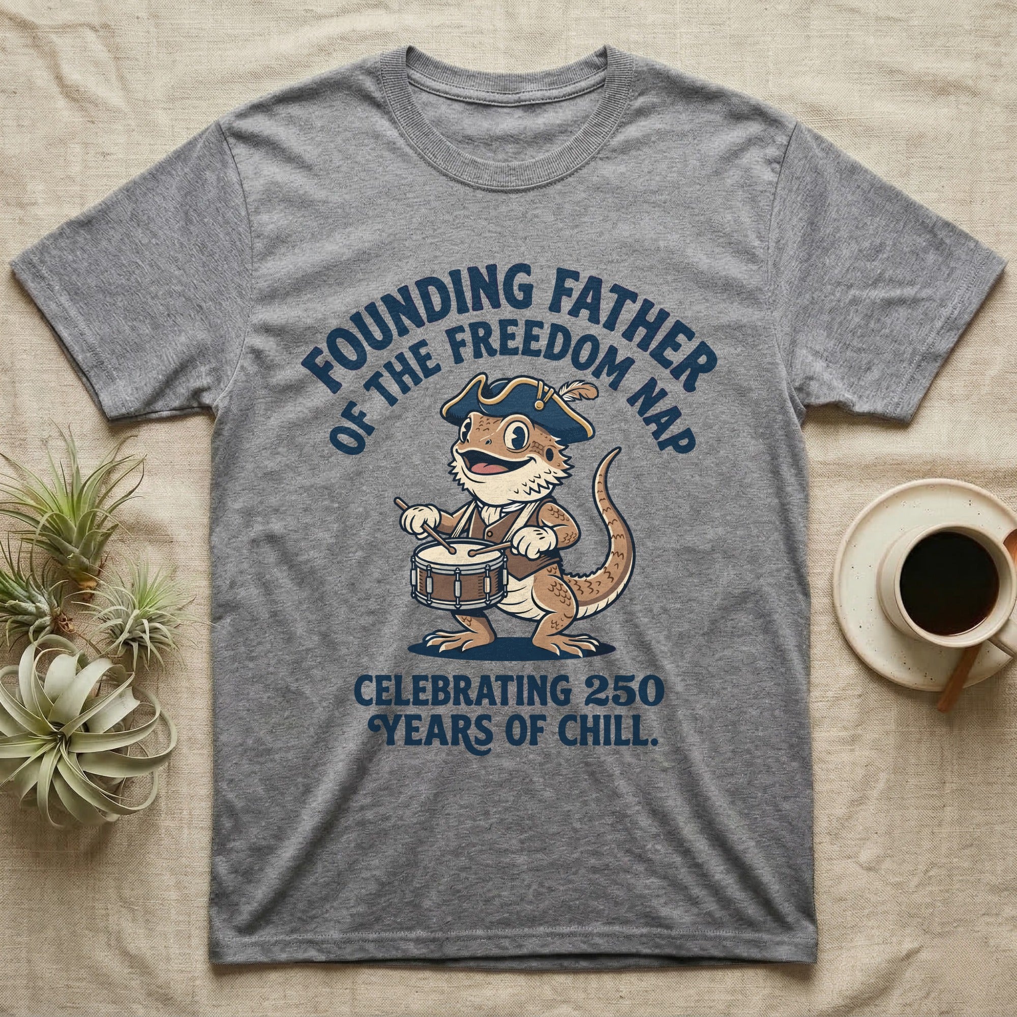 Bearded Dragon Freedom Nap T-Shirt in Sport Grey — Cartoon bearded dragon as a drummer boy under arched text Founding Father of the Freedom Nap, 250 Years of Chill.
