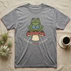 Grey t-shirt with frog on mushroom graphic and "Let me be weird in peace."