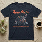 Red-Foot Tortoise Armor T-Shirt in Navy — White-line engraving of a red-footed tortoise on tiptoe under orange Armor-Plated script and a serif line