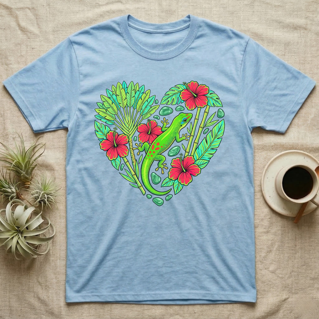 Light blue t-shirt with green gecko and tropical leaves forming a heart shape.