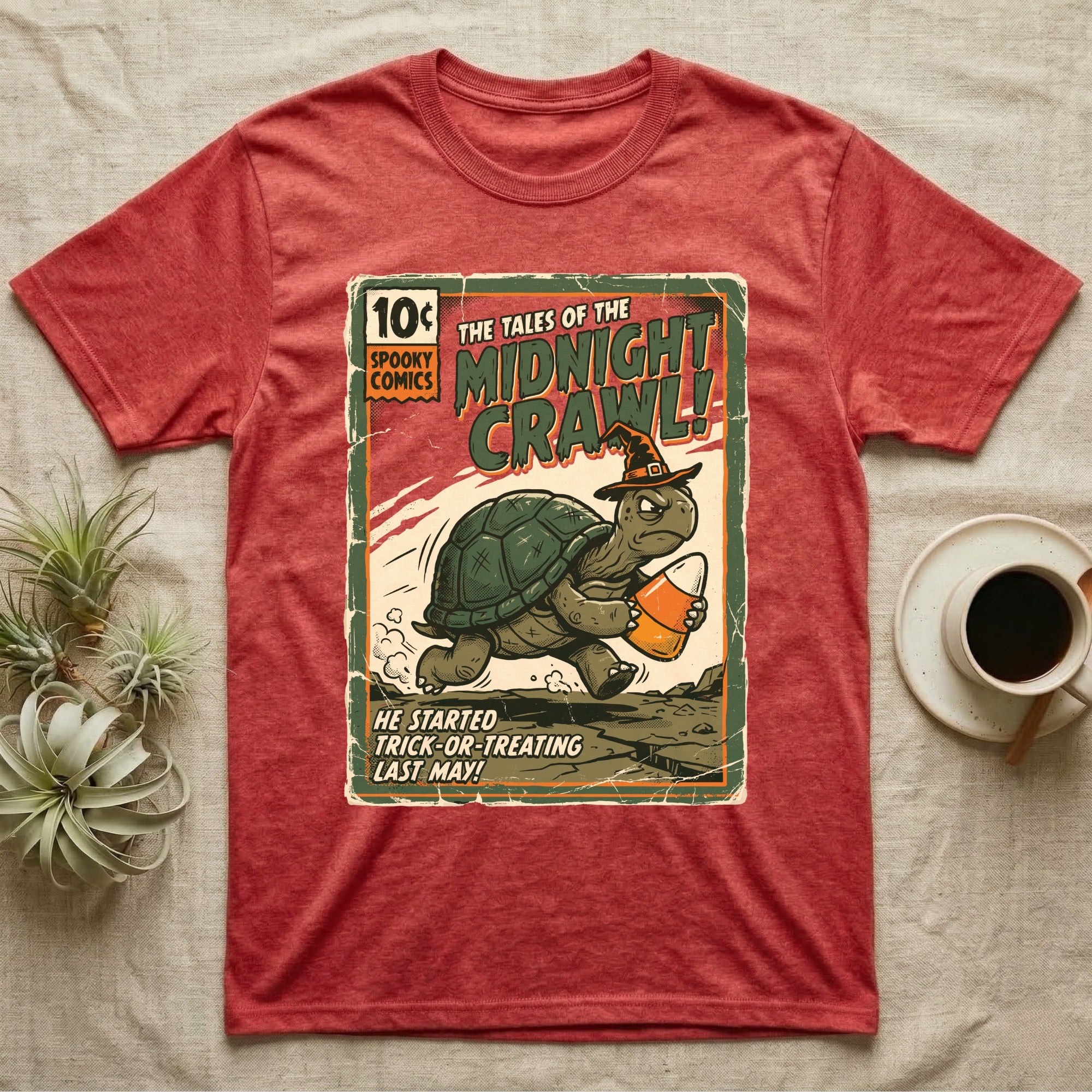 Tortoise Midnight Crawl Vintage T-Shirt in Heather Red — Worn pulp comic cover of a witch-hatted tortoise dashing with a candy pail, "Tales of the Midnight Crawl."