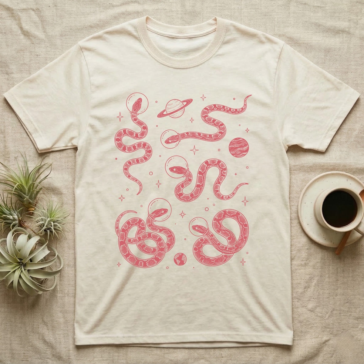 Corn Snake Cosmic T-Shirt in Natural — Vintage screen-print illustration of corn snakes in astronaut helmets floating in space, cosmic crimson monochromatic on dark background.