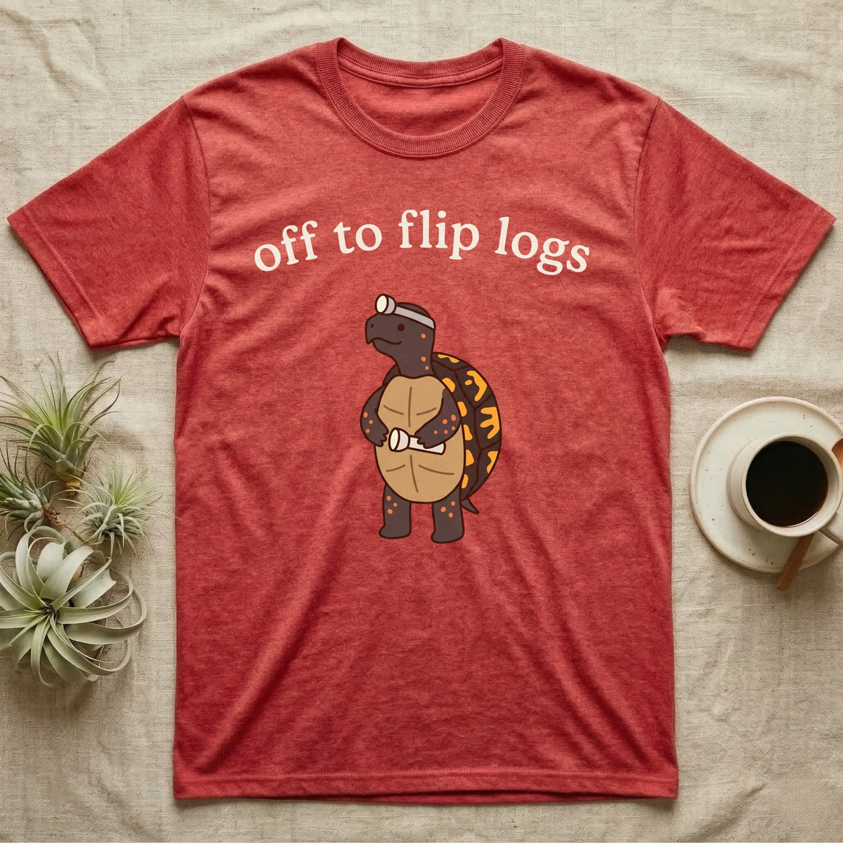 Box Turtle Herping T-Shirt in Heather Red — Minimal doodle of an eastern box turtle standing upright in a headlamp holding a flashlight, under the words off to flip logs