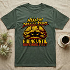 Tortoise Maximum Defense Force T-Shirt in Military Green — Metal graphic of a tortoise glaring from its shell, "Maximum Defense Force, Hiding Until November First."