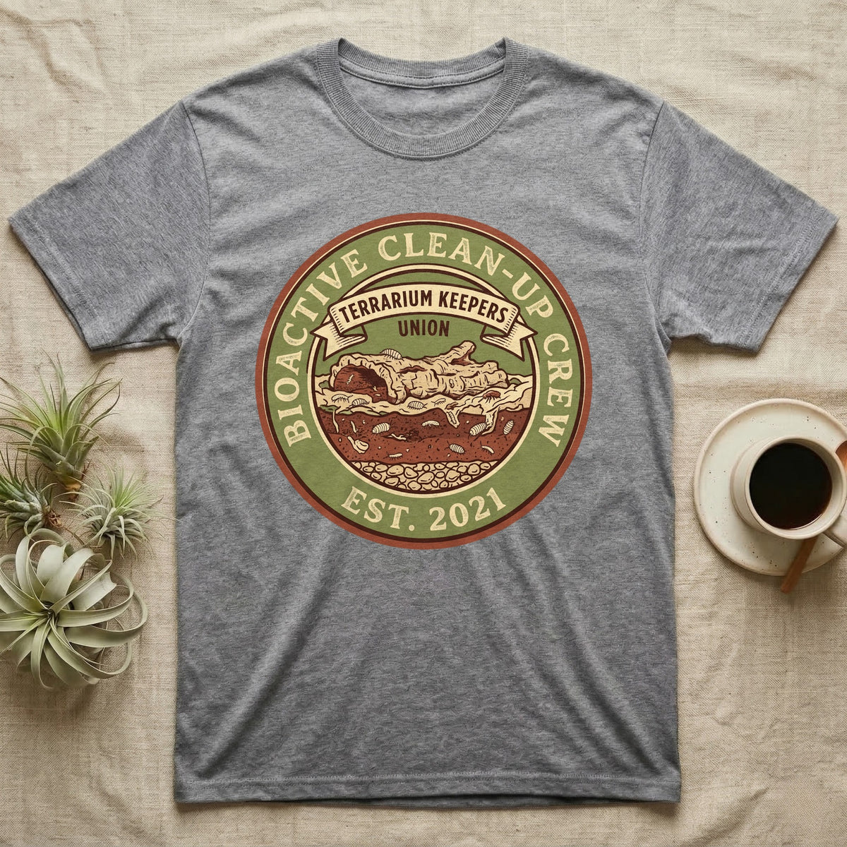 Isopod Terrarium Keepers Union T-Shirt in Sport Grey — Vintage union badge showing a cross-sectioned bioactive vivarium worked by isopods and springtails.