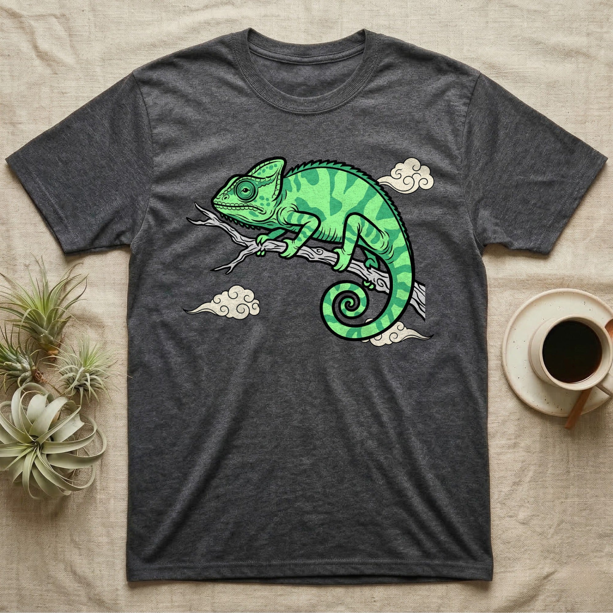 Dark grey t-shirt featuring a cartoon green chameleon on a branch.