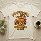 Ball Python October Thermostat T-Shirt in Natural — Metal-band style ball python coiled over a glowing jack-o'-lantern, "October Is Here, Turn Up the Thermostat Or Else."