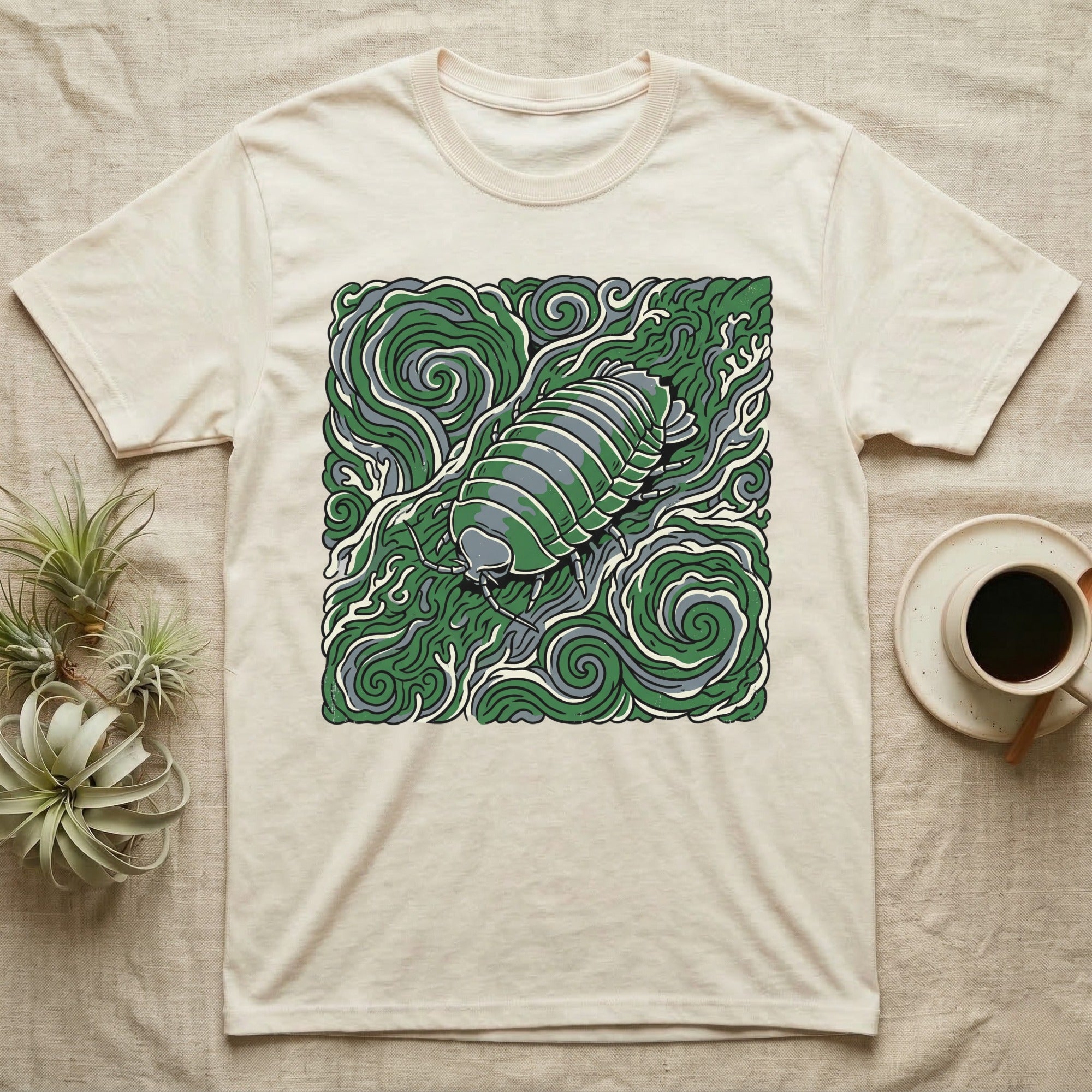 Cream t-shirt with a green, stylized illustration of an isopod.