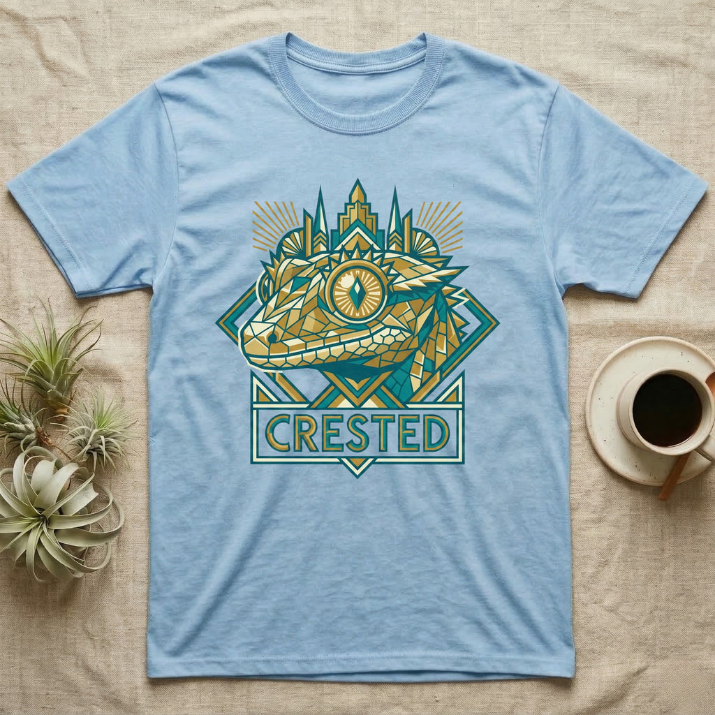 Light blue t-shirt with geometric crested gecko design and city skyline.