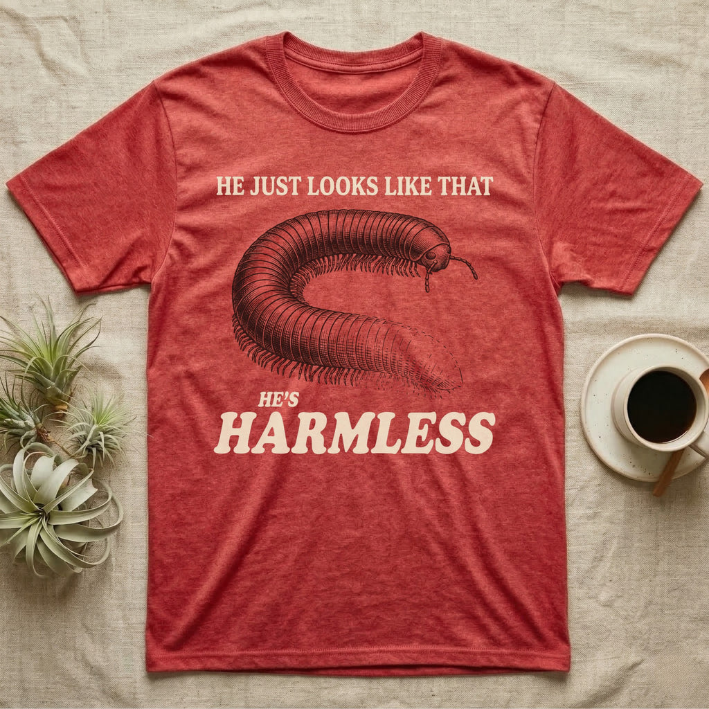 Millipede He's Harmless T-Shirt in Heather Red — Engraved giant African millipede between cream serif lines reading He Just Looks Like That and Harmless.