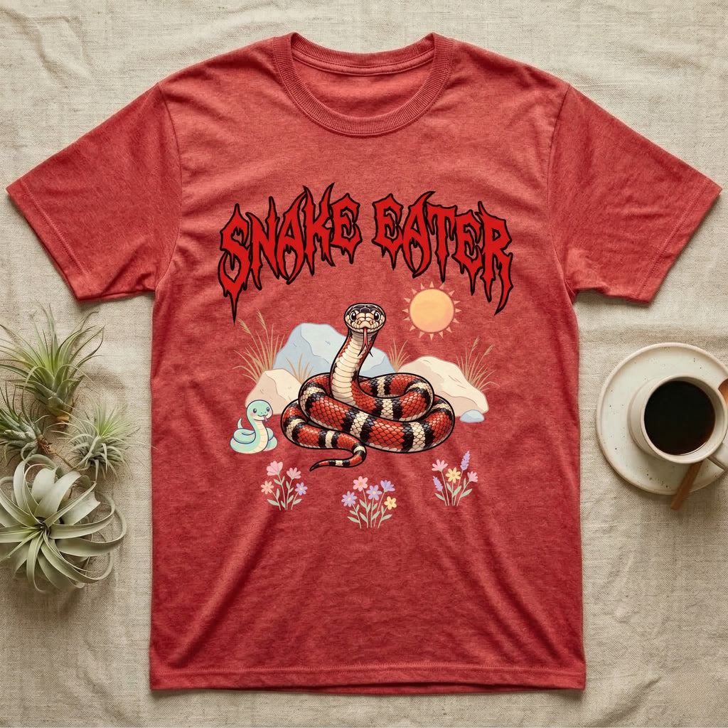 California Kingsnake Feral T-Shirt in Heather Red — Banded California kingsnake coiled with a tiny companion snake under a jagged blood-red metal wordmark and pastel scene.